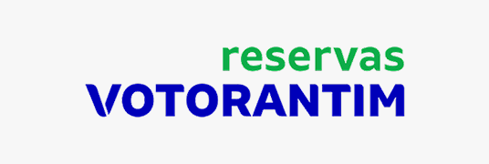 Logotipo 'reservas VOTORANTIM' com 'reservas' em verde e 'VOTORANTIM' em azul sobre fundo branco.