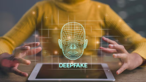 Uma imagem de uma mulher sentada em uma mesma com um tablet, enquanto um holograma de deepfake aparece sobre o aparelho.